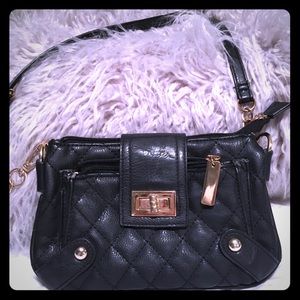 Used but in good condition, small black purse.